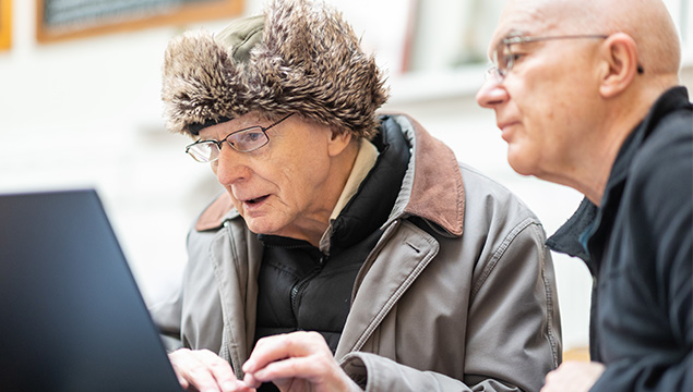elderly man learing to use a computer